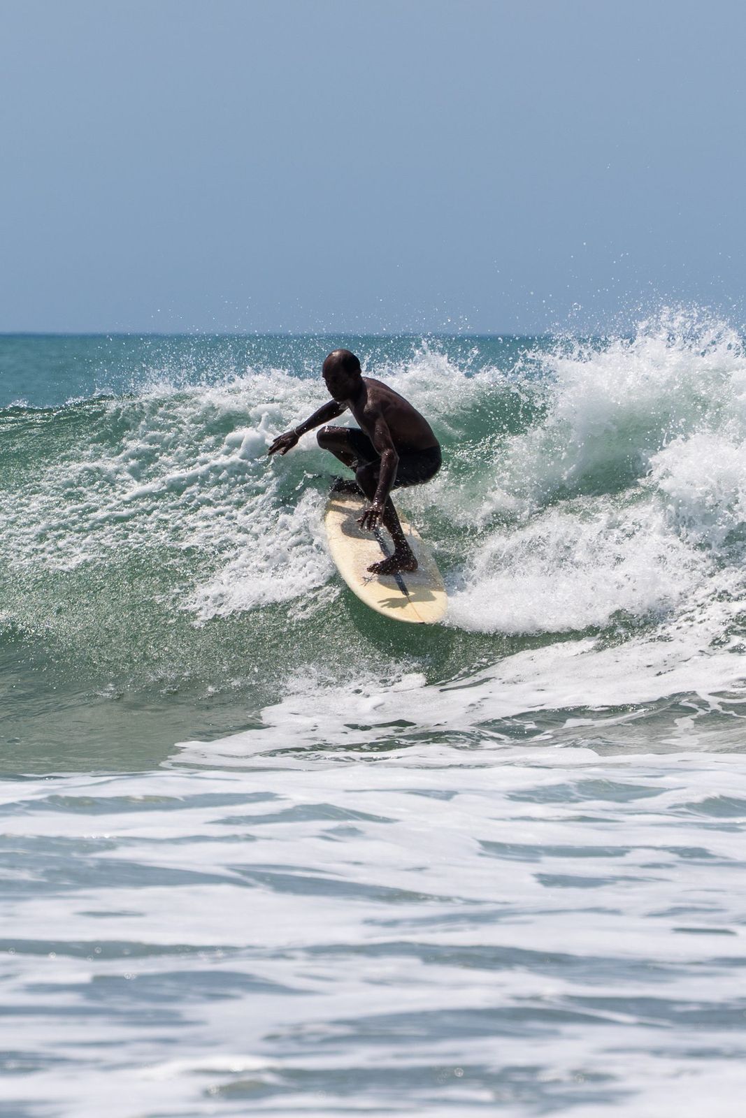 Surfer driving down the line