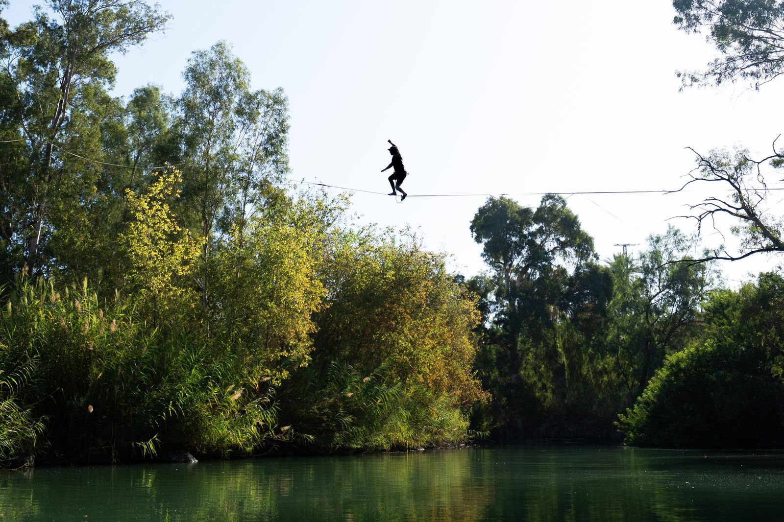 Slackliner above a river