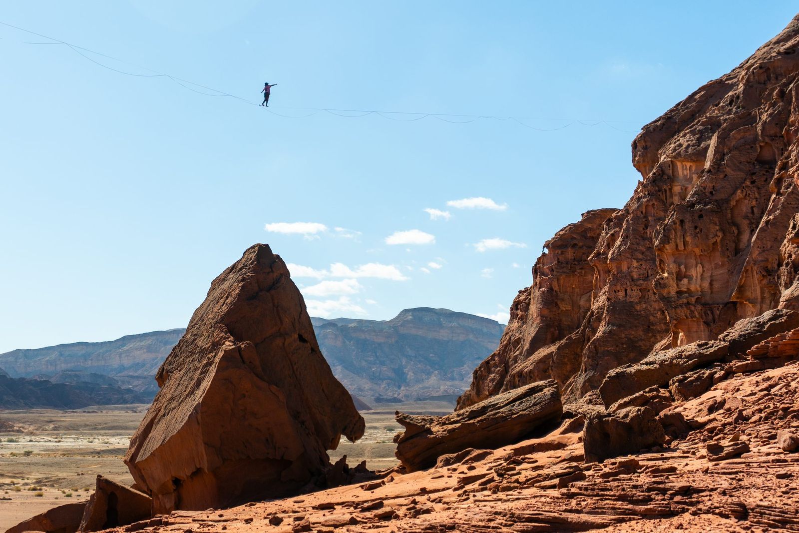 Tiny highliner between desert rock towers